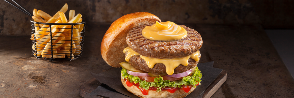 Double burger with cheddar sauce