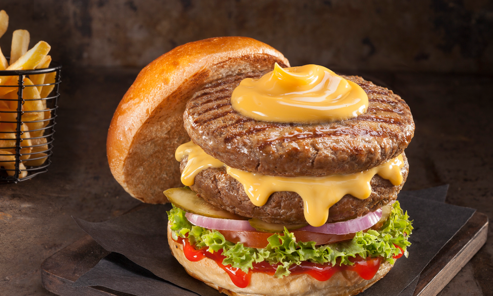 Double burger with cheddar sauce