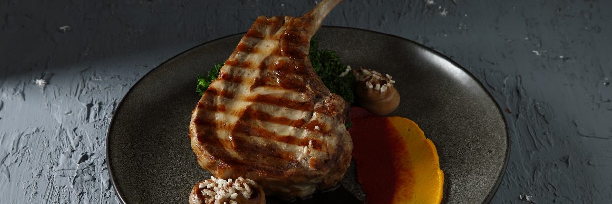 Sous vide pork chop with a trilogy of purées