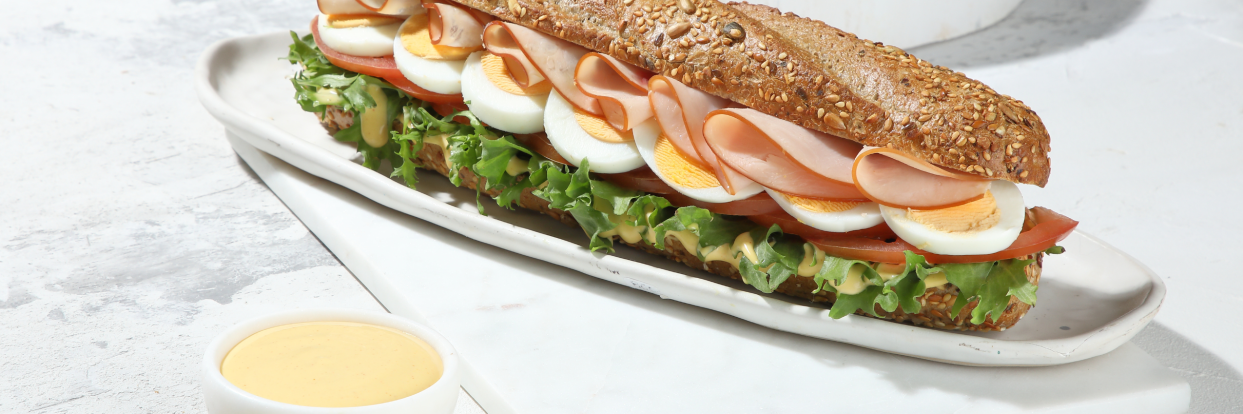Wholegrain baguette with smoked turkey and oriental sandwich cream